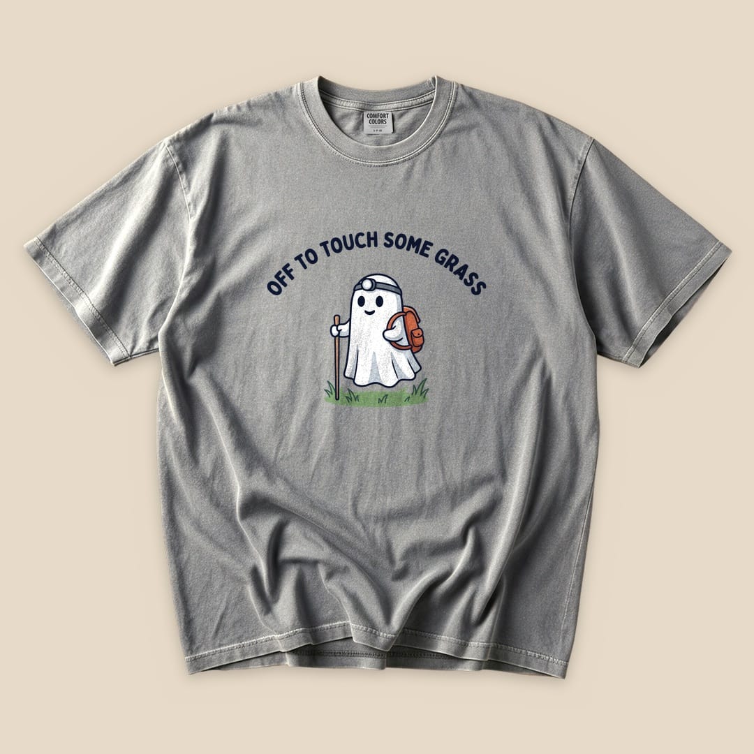 Grey Off to Touch Some Grass T-Shirt with a ghost hiker with a headlamp and backpack graphic