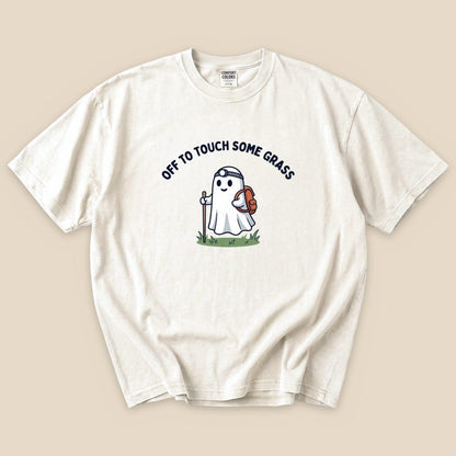 Ivory Off to Touch Some Grass T-Shirt with a ghost hiker with a headlamp and backpack graphic
