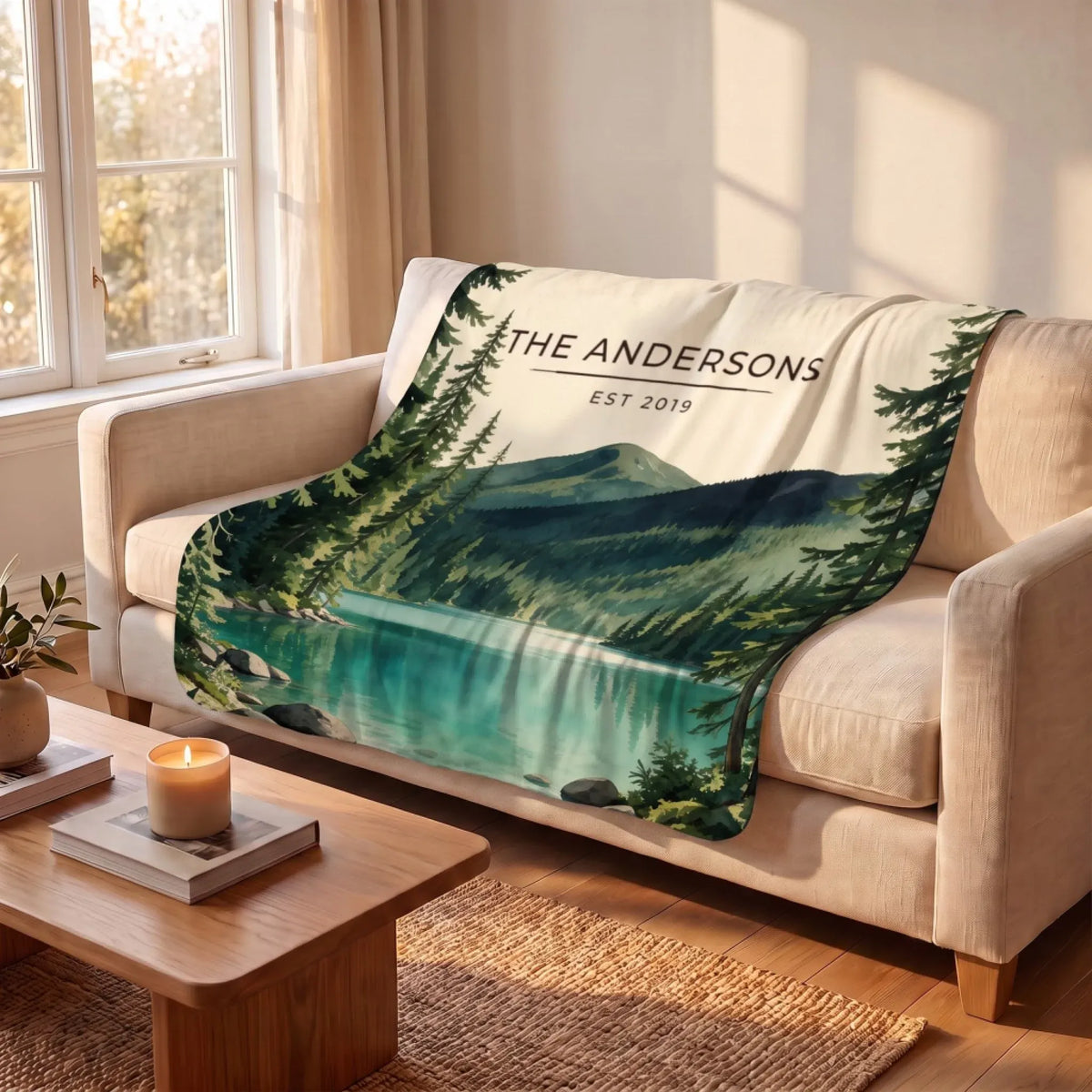 Olympic Lake Crescent Sherpa Blanket draped over a sofa