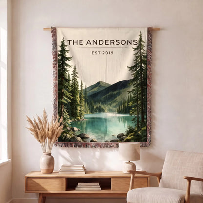 Personalized Olympic Lake Crescent Woven Blanket hanging on a wall, family name woven in