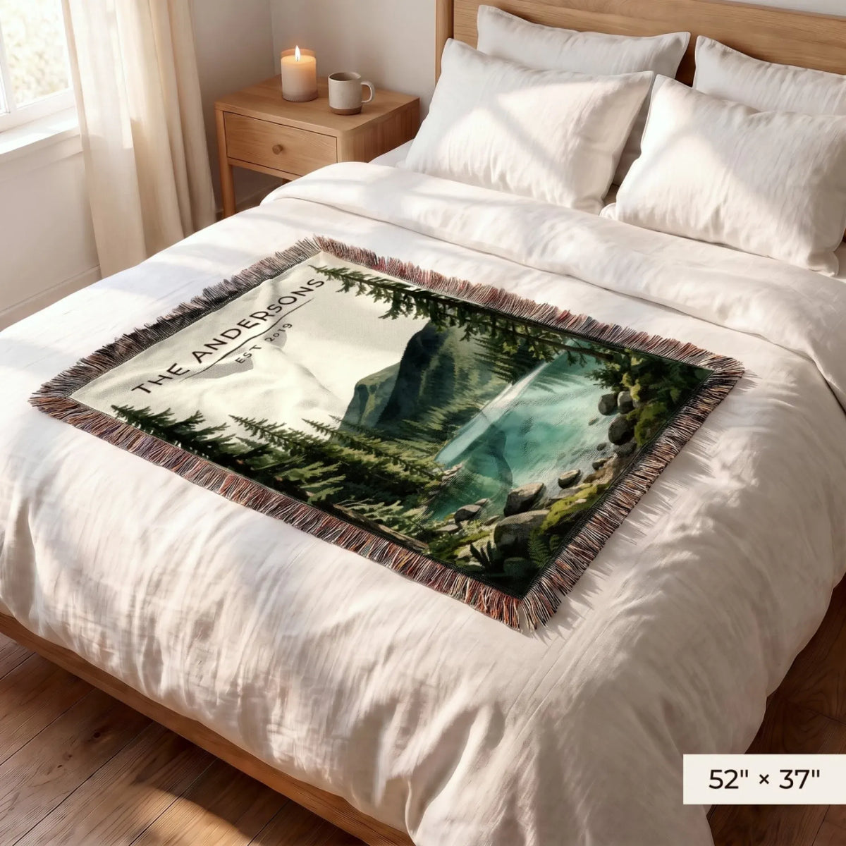 Olympic Lake Crescent Woven Blanket 52x37 on a queen bed