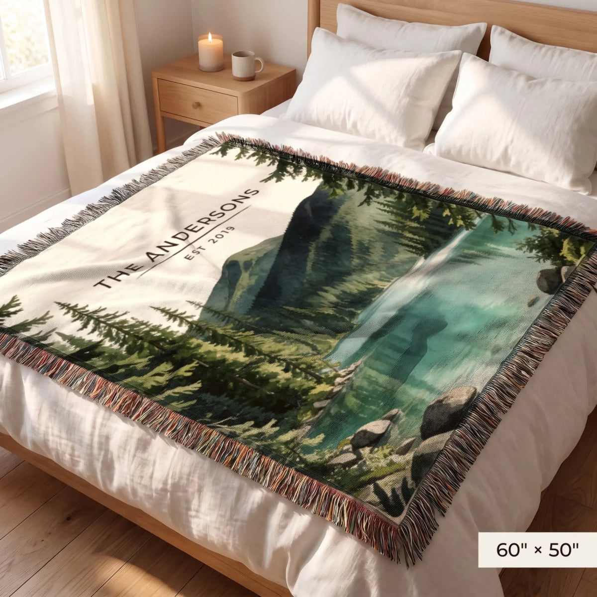 Olympic Lake Crescent Woven Blanket 60x50 on a queen bed