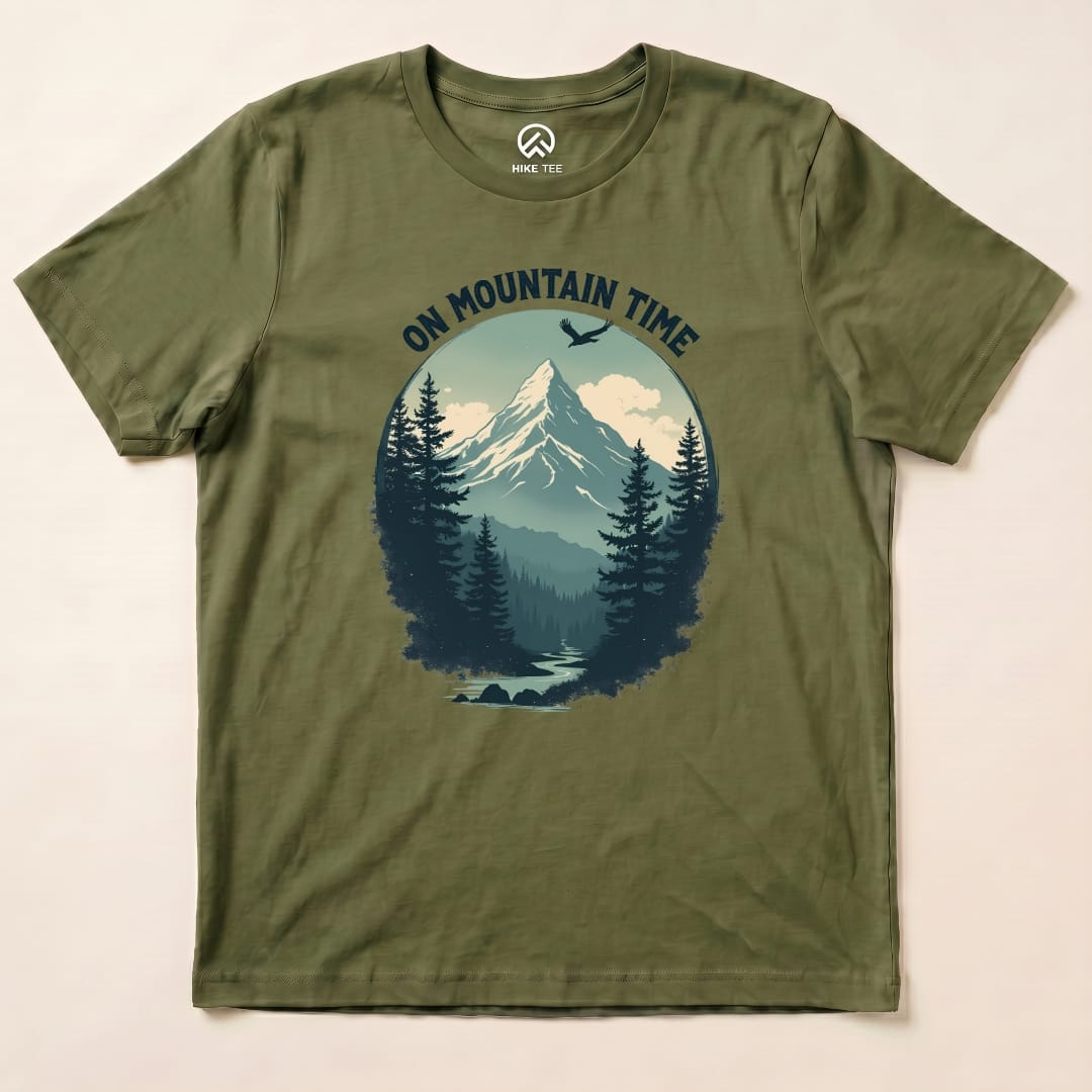 The graphic t-shirt features an artistic mountain scene surrounded by trees and the text "ON MOUNTAIN TIME" above it.
