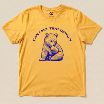 A yellow graphic t-shirt featuring a bear with the phrase "CAN I PET THAT DAWG?!" in blue lettering.