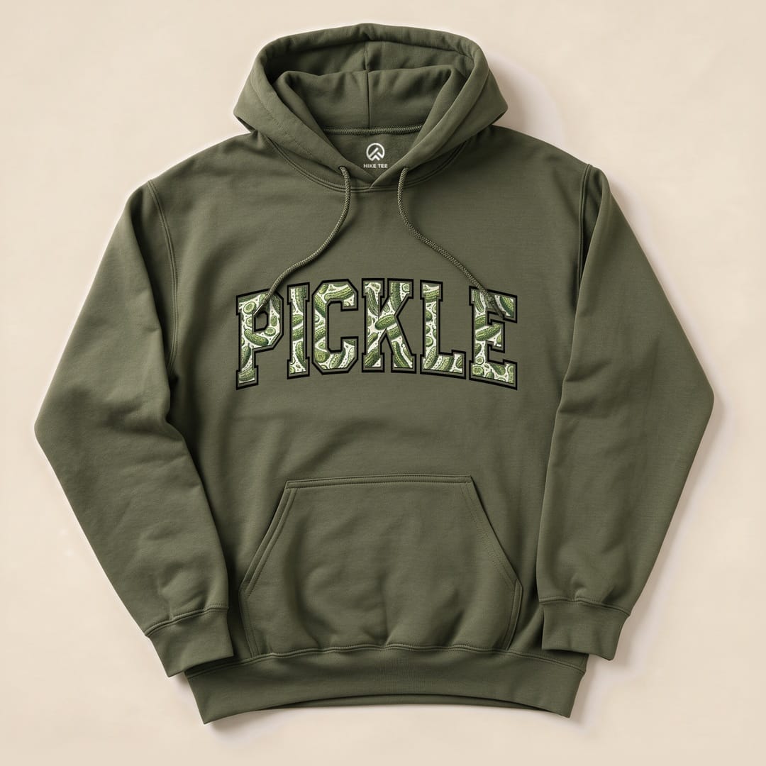 A graphic hoodie in olive green features the word "PICKLE" in bold, playful lettering with a pickle design, labeled as "Pickle Camping Hoodie.
