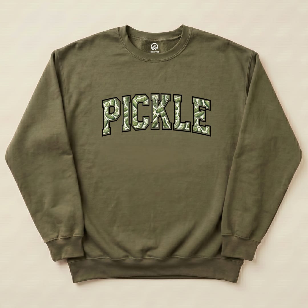 A flat olive green "Pickle Camping Sweatshirt" featuring bold, camo-style lettering that reads "PICKLE".