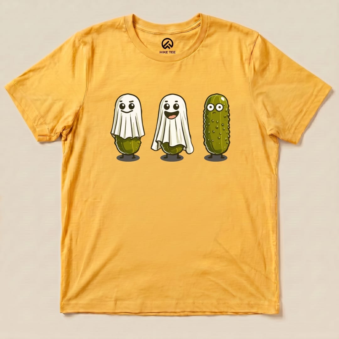A graphic t-shirt featuring three cartoon pickle ghosts, with playful expressions, against a vibrant yellow background.