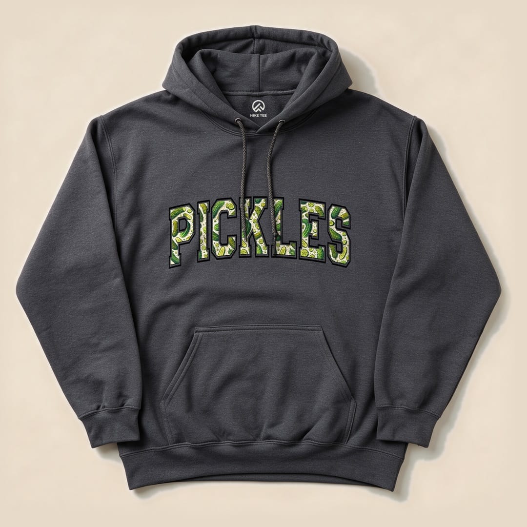 A dark gray Pickles Hoodie featuring bold, green lettering spelling "PICKLES" with a fun graphic design of pickles.