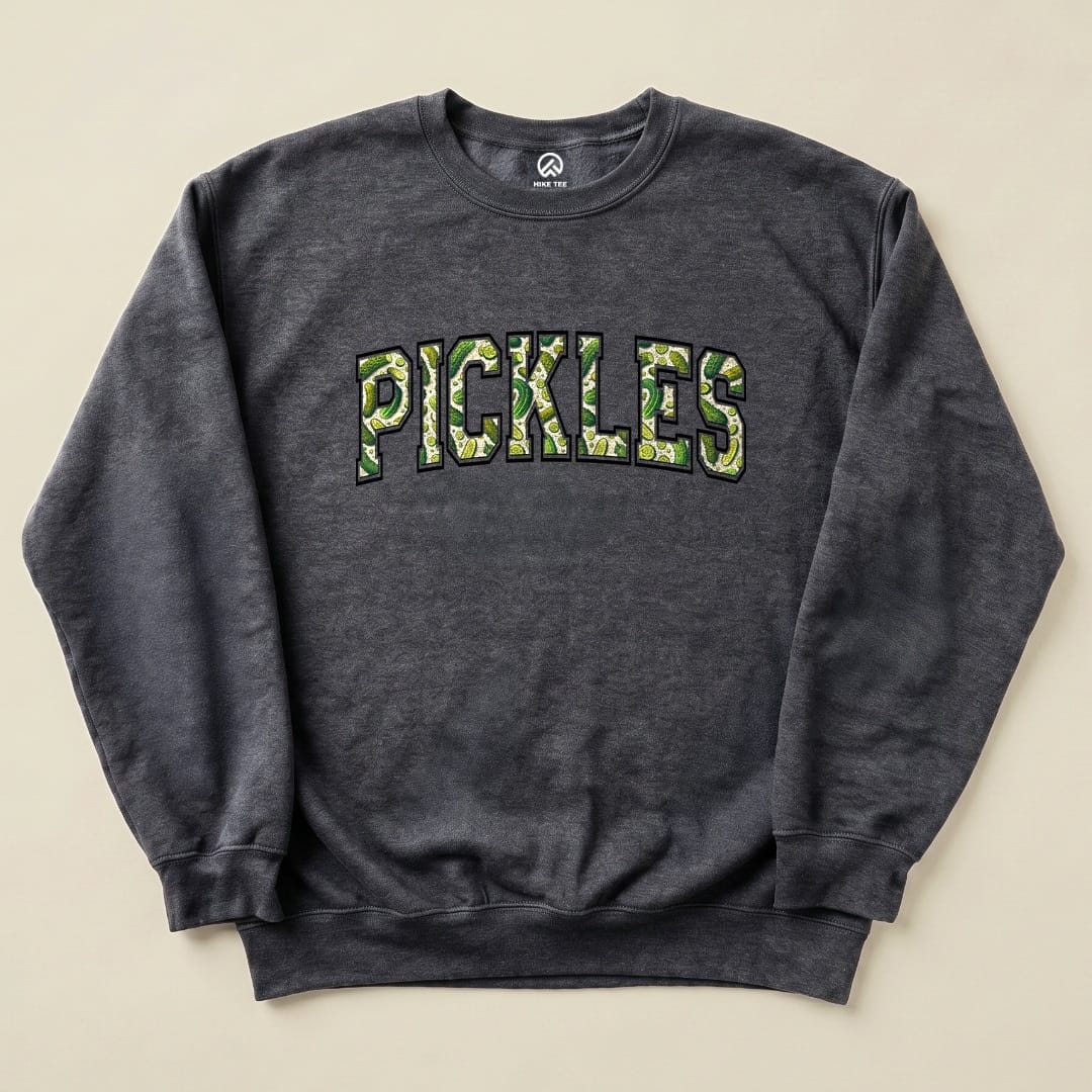 A dark gray "Pickles Sweatshirt" featuring bold green lettering with a pickle pattern on the word "PICKLES.