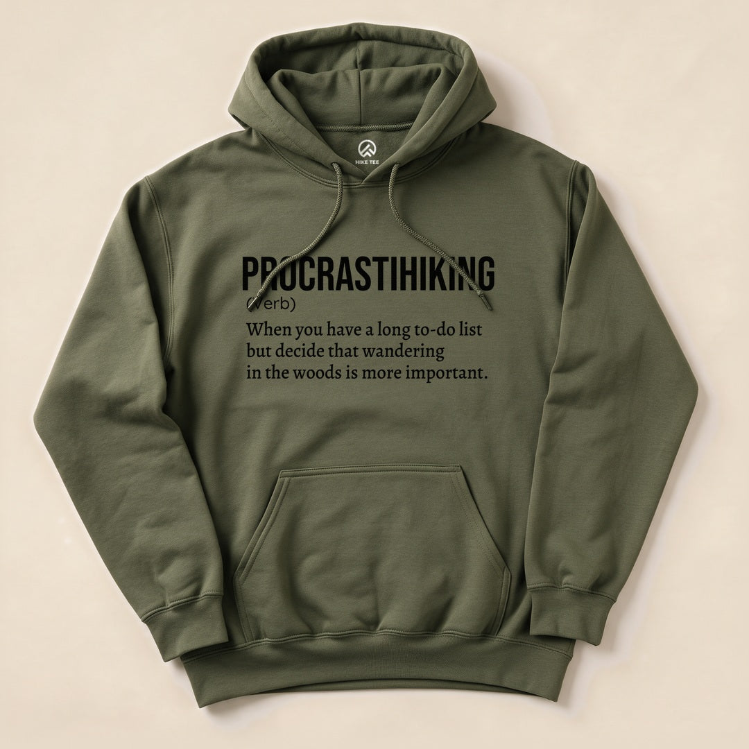 Olive green hoodie featuring "Procrastihiking Definition Hoodie" graphic with the definition of procrastihiking printed in bold text.
