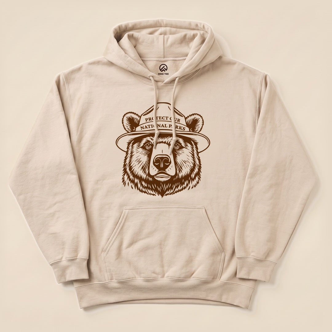 Sand Protect Our National Parks Bear Hoodie with a line art bear badge