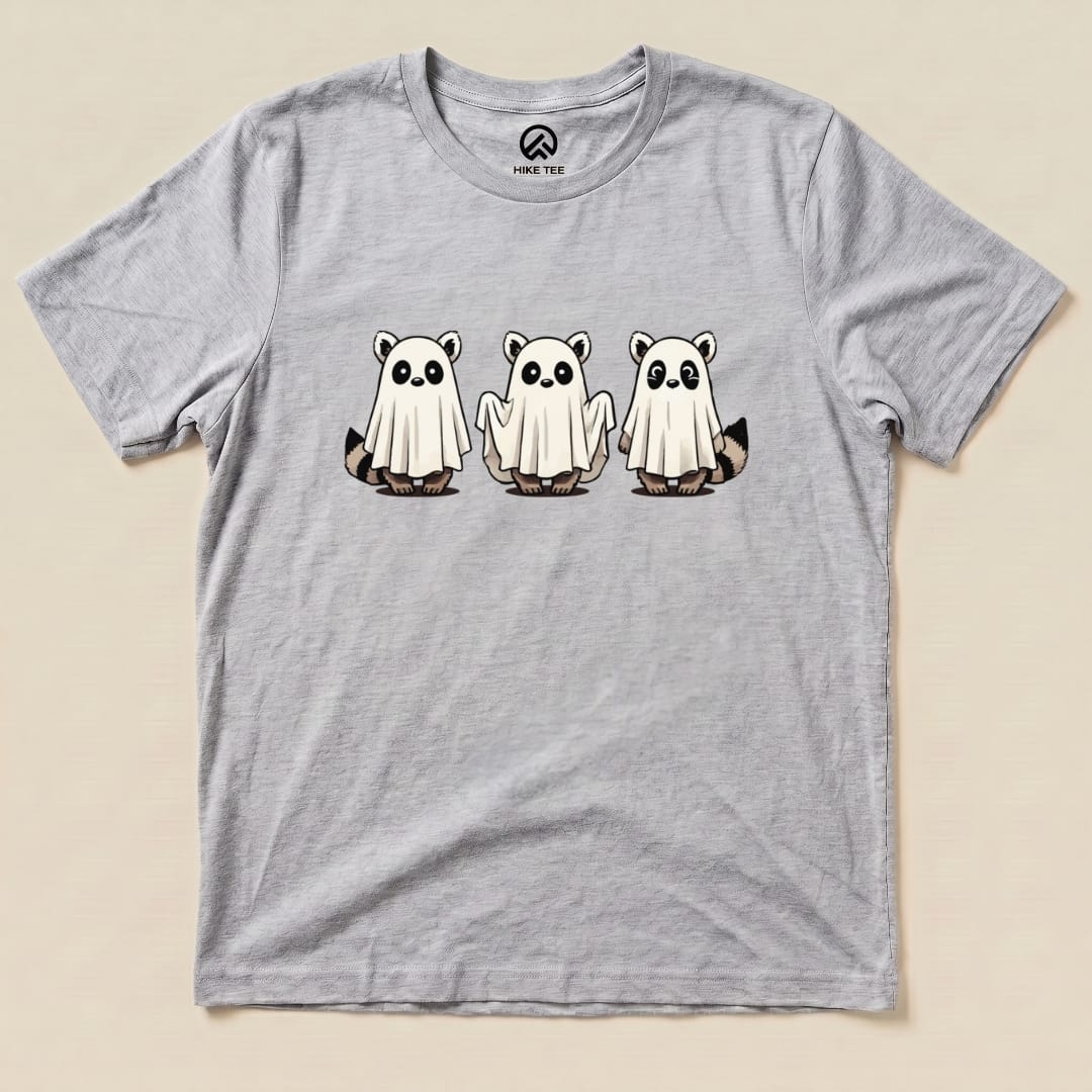 A gray graphic t-shirt featuring three raccoons dressed as ghosts, titled "Raccoon Ghosts Shirt.