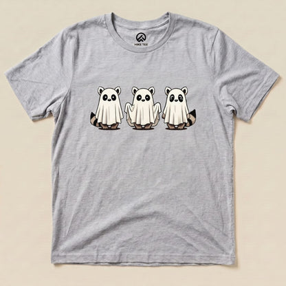 A gray graphic t-shirt featuring three raccoons dressed as ghosts, titled "Raccoon Ghosts Shirt.