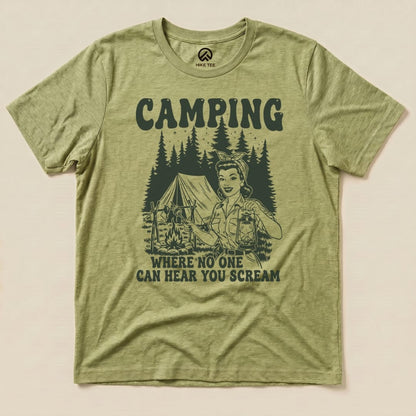 A graphic t-shirt featuring a retro camping scene with a woman holding a lantern and the slogan "Camping: Where No One Can Hear You Scream.