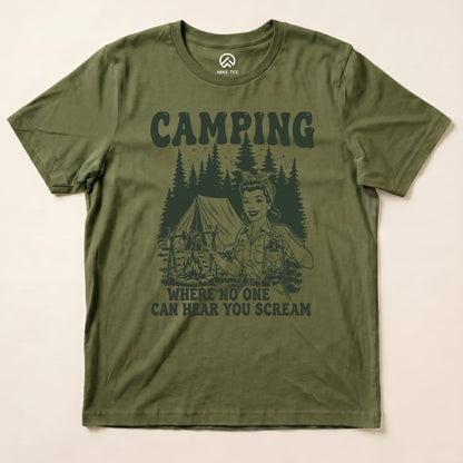 The olive green graphic t-shirt features a vintage camping scene with the slogan "CAMPING WHERE NO ONE CAN HEAR YOU SCREAM" below a cheerful character holding a lantern.
