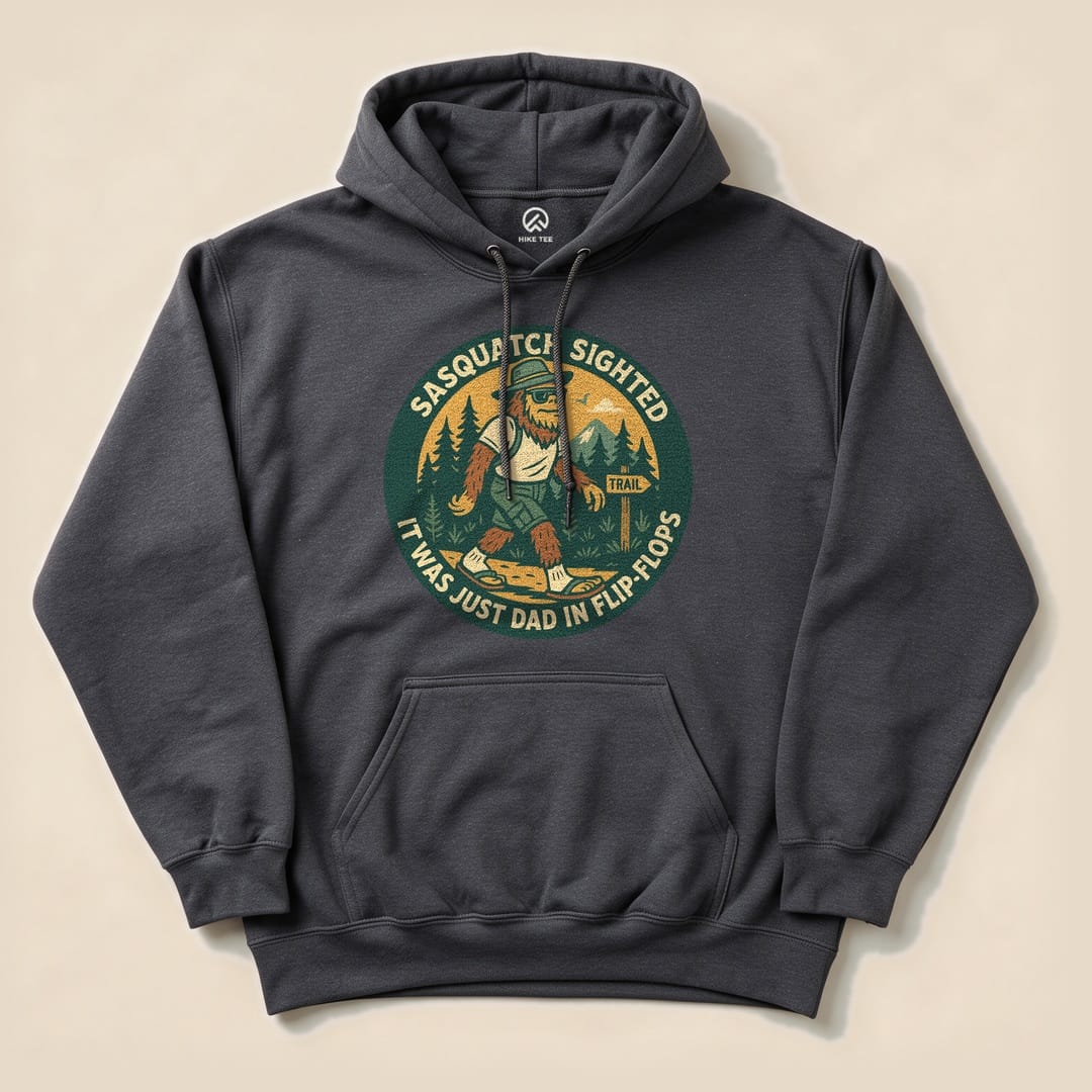 The "Sasquatch Sighted Hoodie" features a graphic of a humorous Sasquatch wearing flip-flops, surrounded by trees and mountains.