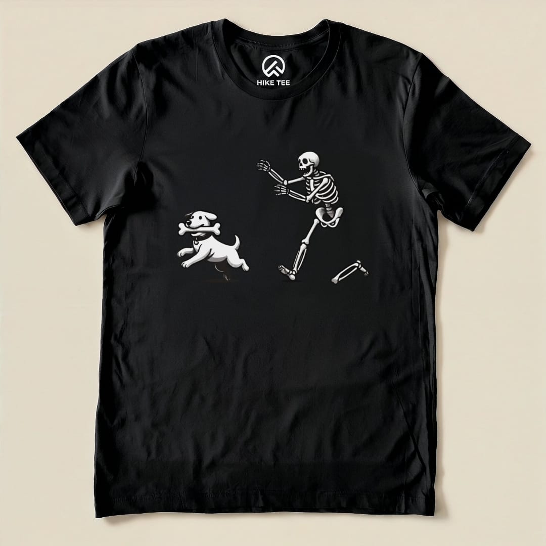 The Skeleton and Dog Shirt features a playful graphic of a skeleton running alongside a cheerful dog on a black tee.