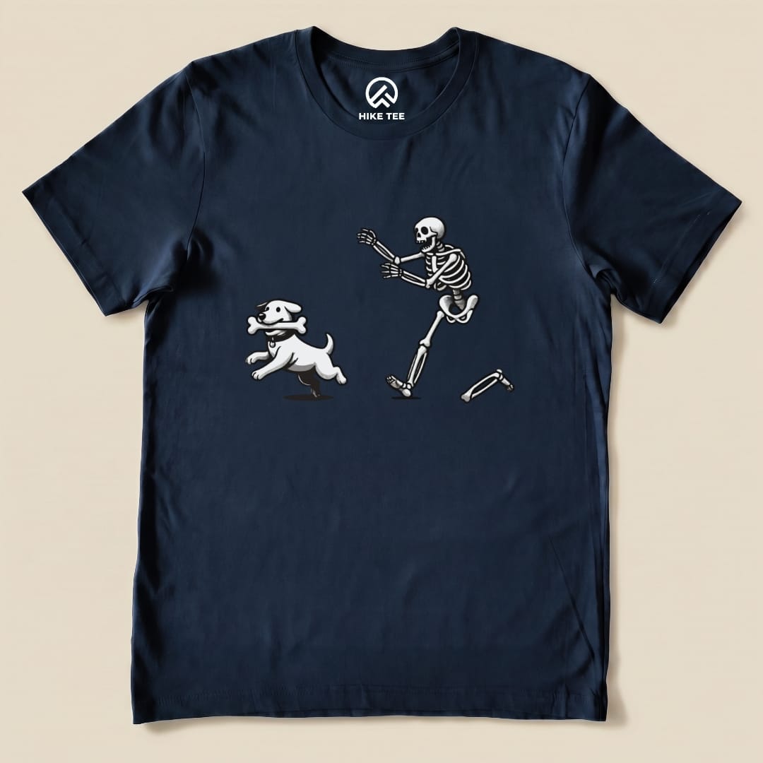 A graphic t-shirt featuring a playful skeleton chasing a dog holding a bone, titled "Skeleton and Dog Shirt.