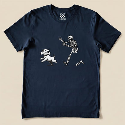 A graphic t-shirt featuring a playful skeleton chasing a dog holding a bone, titled "Skeleton and Dog Shirt.
