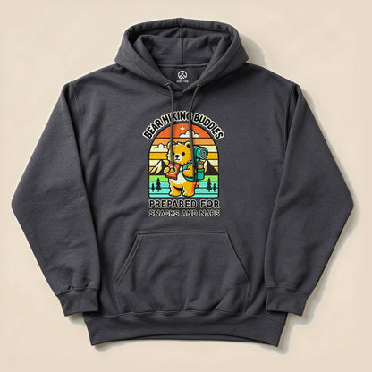 A dark gray hoodie featuring a playful bear graphic, holding a camping backpack with the text "Prepared for Snacks and Naps Hiking Bear Hoodie.