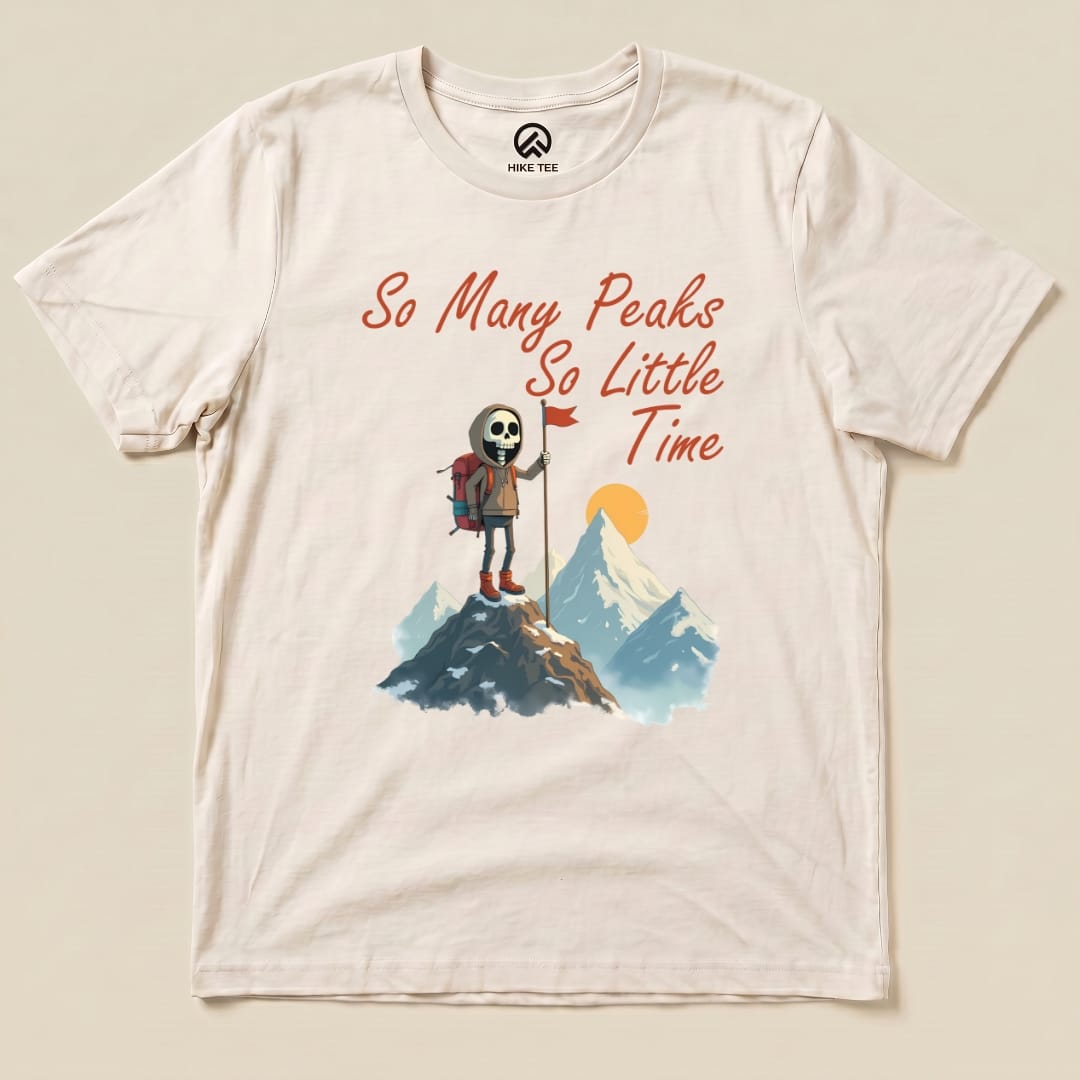 The "So Many Peaks Shirt" features a graphic of a skeleton hiker standing on a mountain peak with the text "So Many Peaks So Little Time" above.