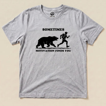 Athletic Heather Sometimes Motivation Finds You Shirt with a bear chasing a runner graphic