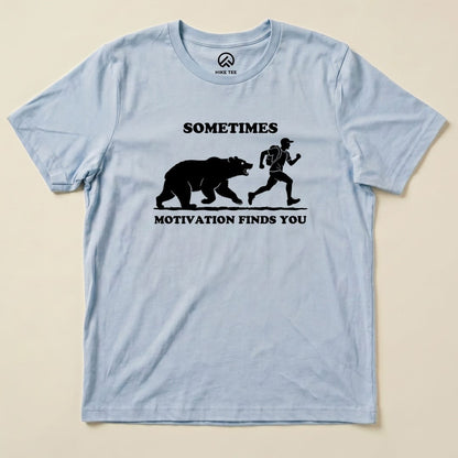 Baby Blue Sometimes Motivation Finds You Shirt with a bear chasing a runner graphic