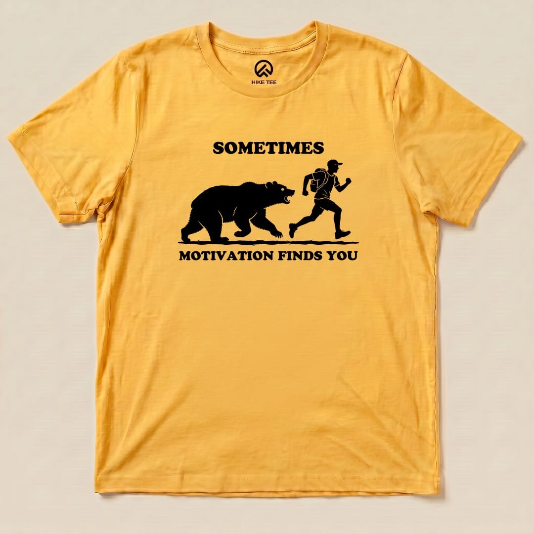 Yellow Gold Sometimes Motivation Finds You Shirt with a bear chasing a runner graphic