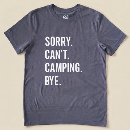 A graphic t-shirt in gray displaying the slogan "Sorry. Can't. Camping. Bye." in bold white letters.