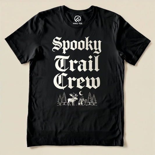 The black graphic t-shirt features the words "Spooky Trail Crew" in bold lettering, illustrated with a moose and raccoon in a forest scene.