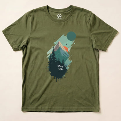 The Stay Wild Shirt features a mountain and forest graphic with vibrant colors and the phrase "Stay Wild" prominently displayed.