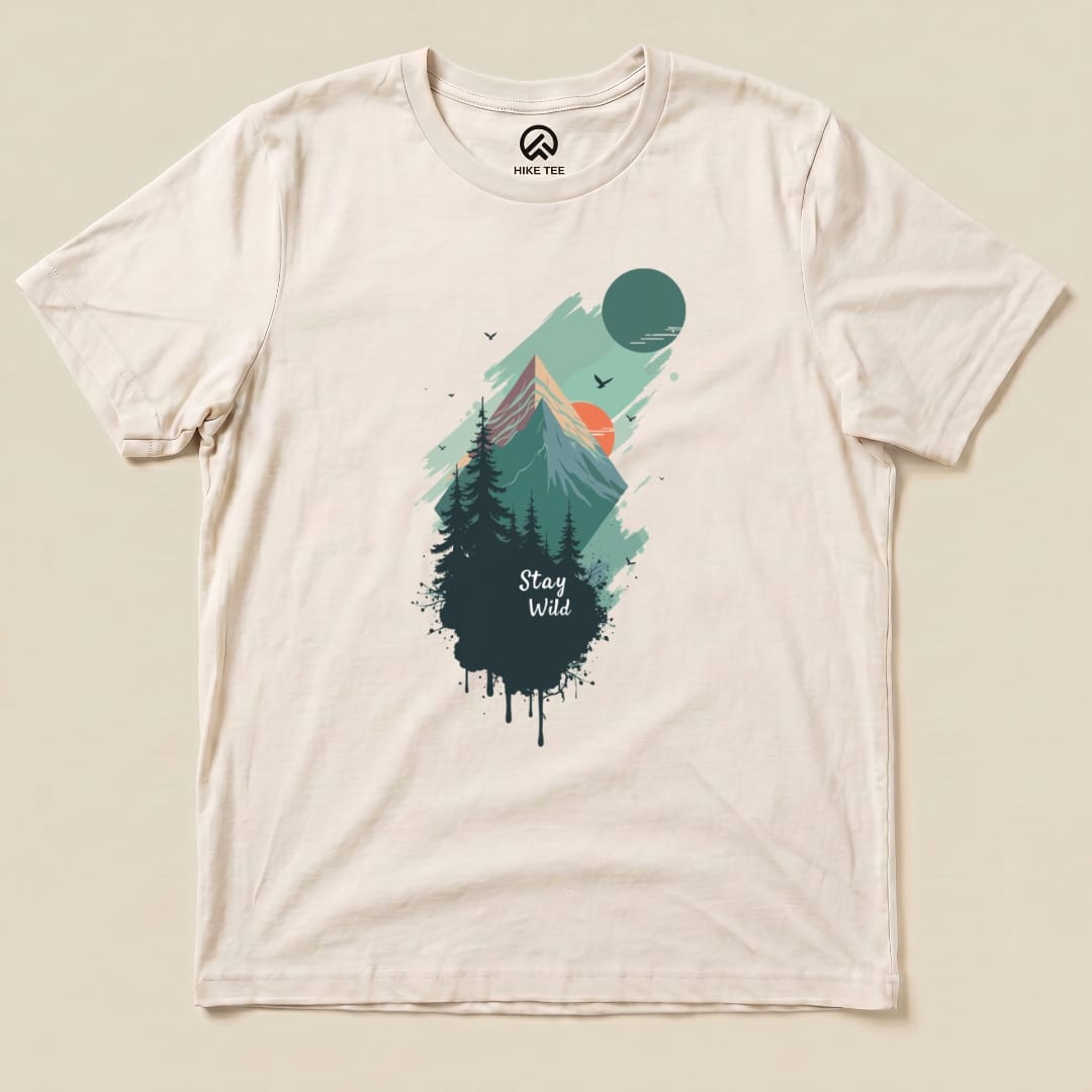 The "Stay Wild Shirt" features a colorful mountain and forest graphic with the words "Stay Wild" printed below, showcasing a nature-inspired design.