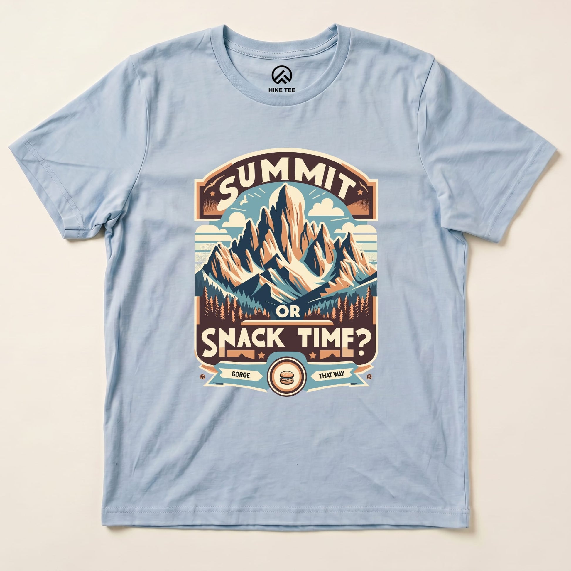 Light blue graphic t-shirt featuring a mountain design with "Summit Or Snack Time?" text, perfect for outdoor enthusiasts.