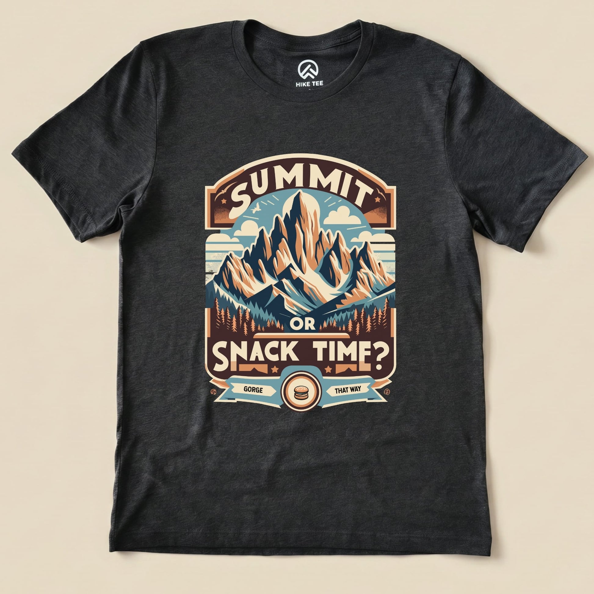 Graphic t-shirt featuring a mountain design and the slogan "Summit or Snack Time?" perfect for outdoor enthusiasts.