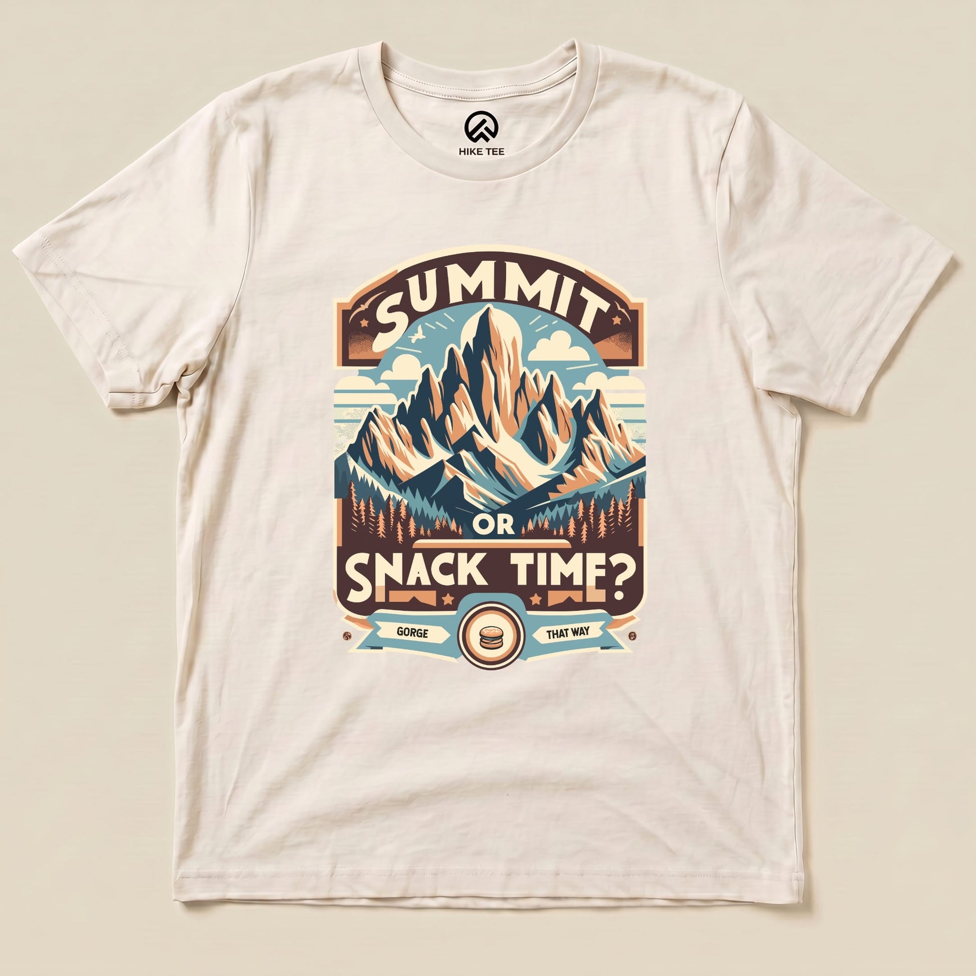 Graphic t-shirt featuring "Summit Or Snack Time?" slogan with a mountain scene, perfect for outdoor enthusiasts and hikers.