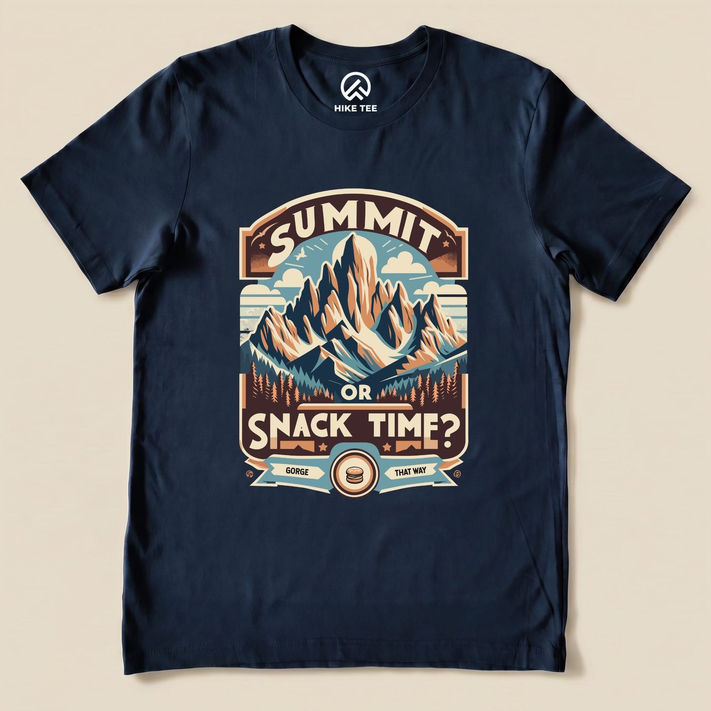 Navy graphic t-shirt featuring a mountain scene with the words "Summit Or Snack Time?" and a playful snack reference.