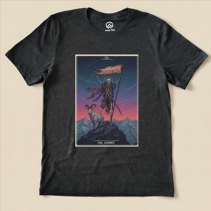 A black graphic t-shirt featuring a skeleton holding a flag labeled "CONQUEROR," accompanied by a goat against a mountain backdrop, titled "The Summit Tarrot Card Shirt.