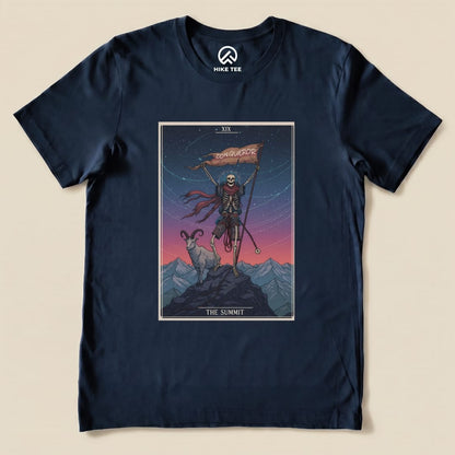 A graphic t-shirt featuring a skeleton holding a flag labeled "Conqueror" and standing beside a ram, titled “The Summit Tarot Card Shirt.”