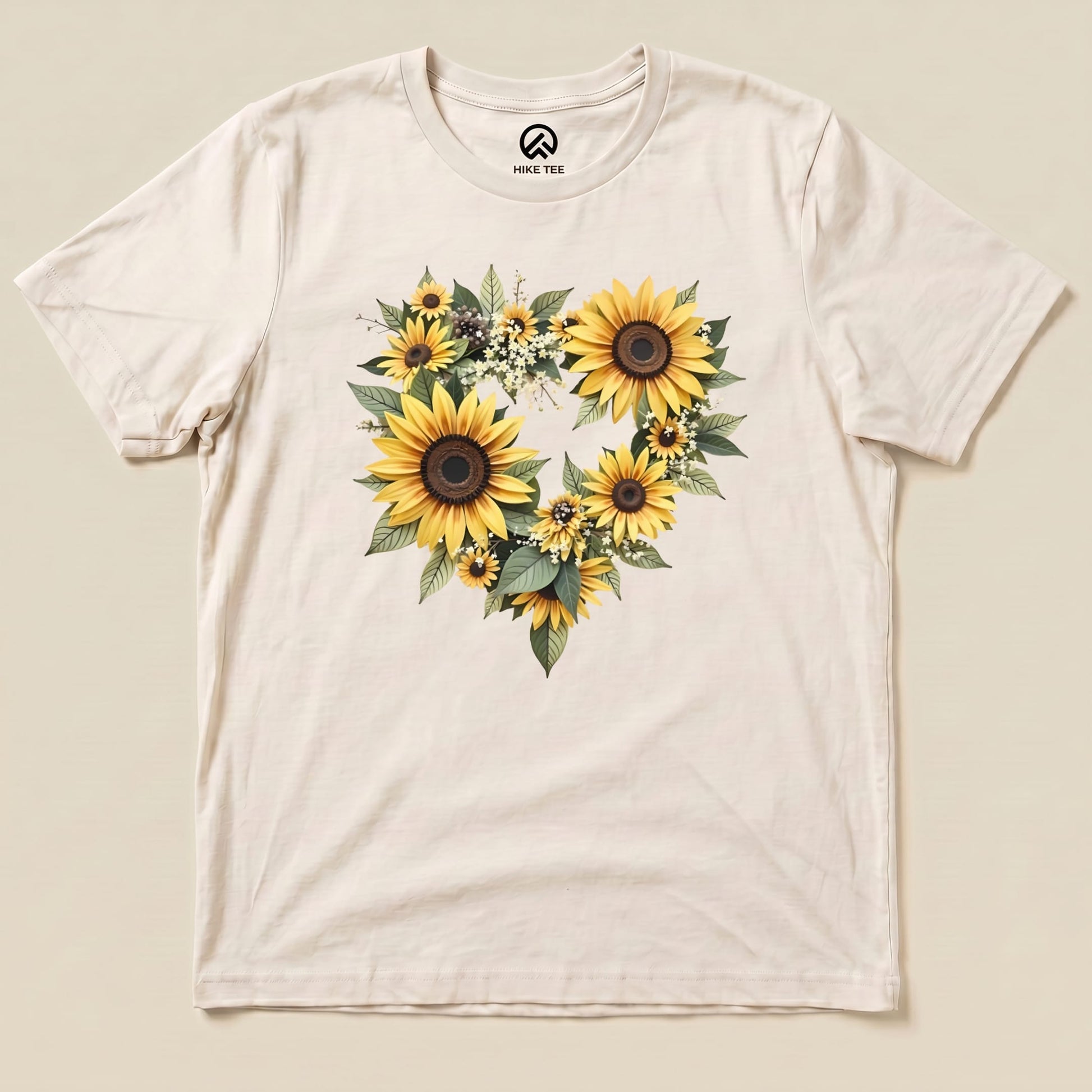 A graphic t-shirt featuring a heart-shaped arrangement of vibrant sunflowers and greenery, labeled "Sunflowers Heart Shirt.