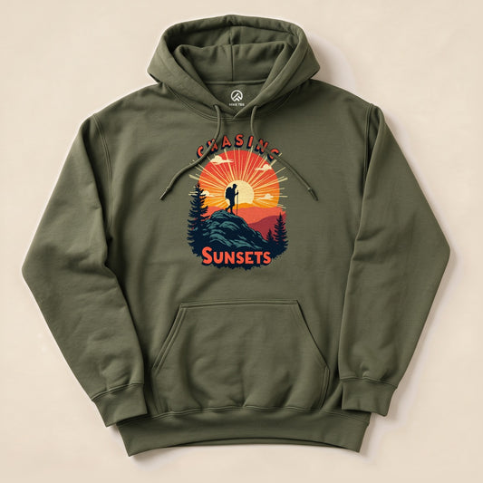 Military Green Chasing Sunsets Hoodie with a hiker on a mountain at sunset