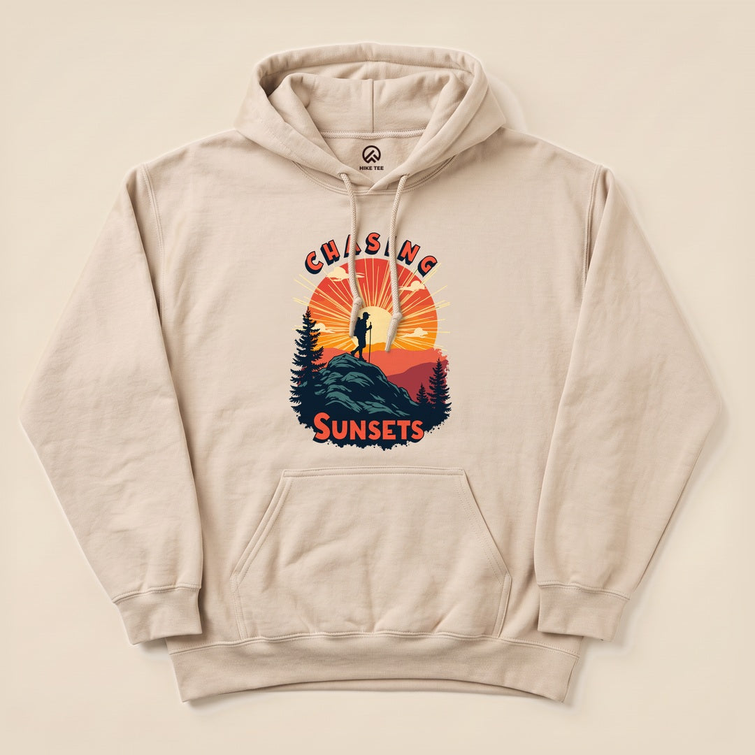 Sand Chasing Sunsets Hoodie with a hiker on a mountain at sunset