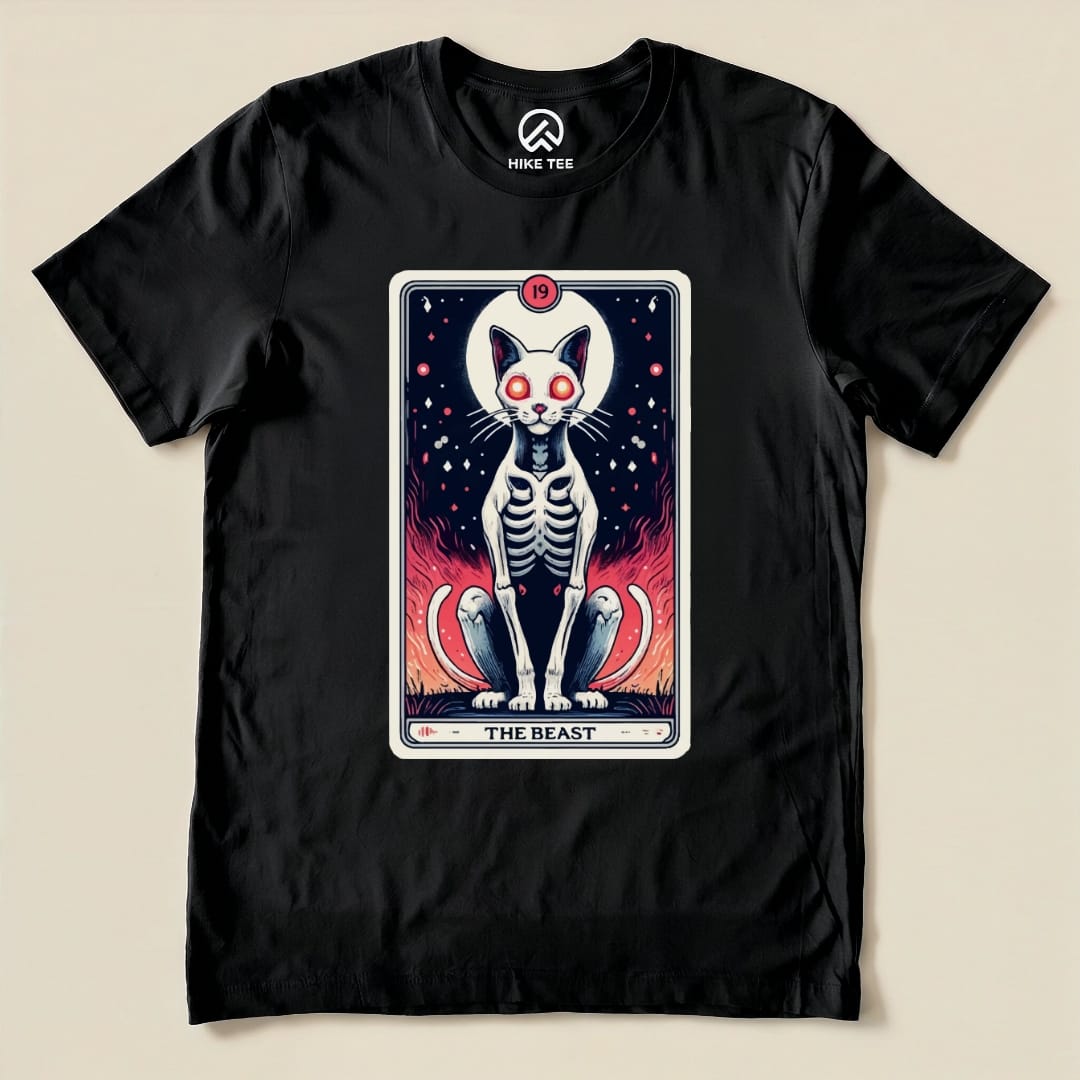 A black graphic t-shirt features "The Beast Tarrot Cat shirt" design, showcasing a skeletal cat with glowing eyes amidst fiery colors.