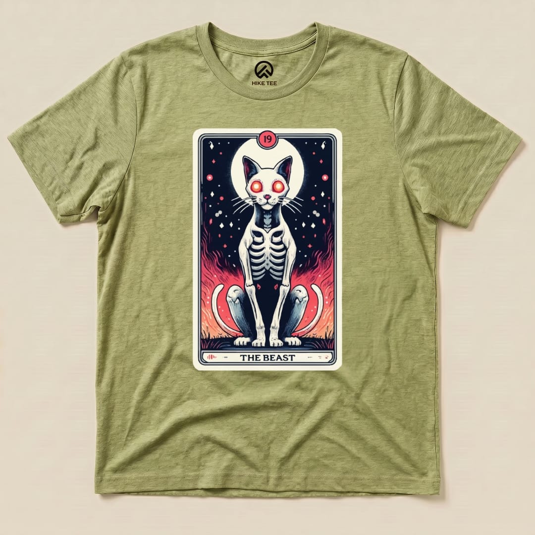 The graphic t-shirt features "The Beast Tarrot Cat" design, showcasing a skeleton cat with fiery red accents on an olive green shirt.
