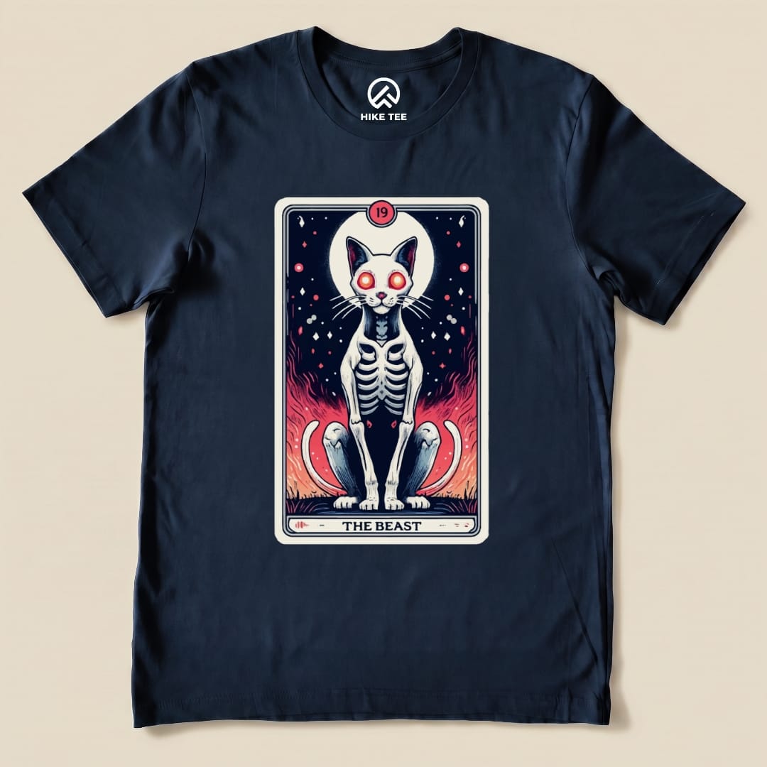 A graphic t-shirt featuring "The Beast Tarrot Cat shirt" design with a skeleton cat and fiery background elements.