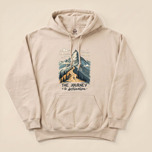 A beige "The Journey Hoodie" features a graphic of a mountain scene with the slogan "THE JOURNEY is the destination" printed below.