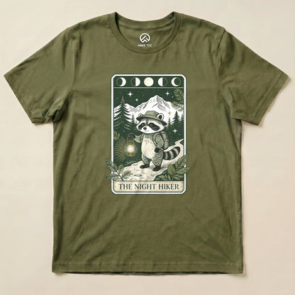 Military Green The Night Hiker Shirt with a raccoon hiker with a lantern on a moonlit tarot card graphic