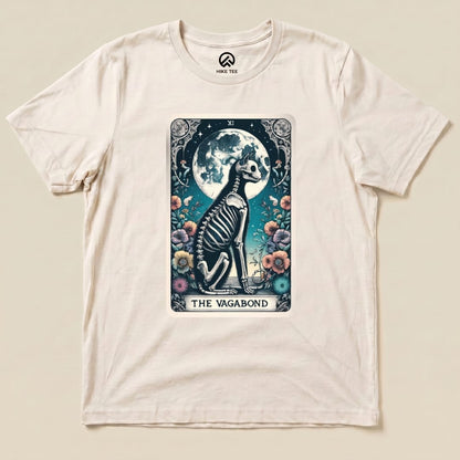 The Vagabond Tarot Card Cat Shirt features an illustrated skeleton cat sitting among colorful flowers and a full moon backdrop.