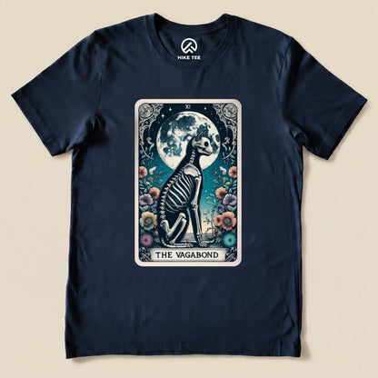 A graphic t-shirt featuring "The Vagabond Tarot Card Cat Shirt" with a skeleton cat design against a moonlit backdrop.