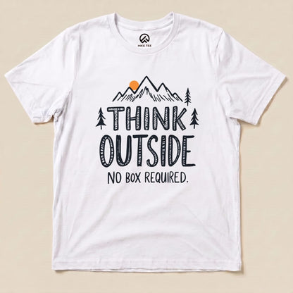 A graphic t-shirt featuring the slogan "THINK OUTSIDE" with mountains and trees, along with the phrase "NO BOX REQUIRED.