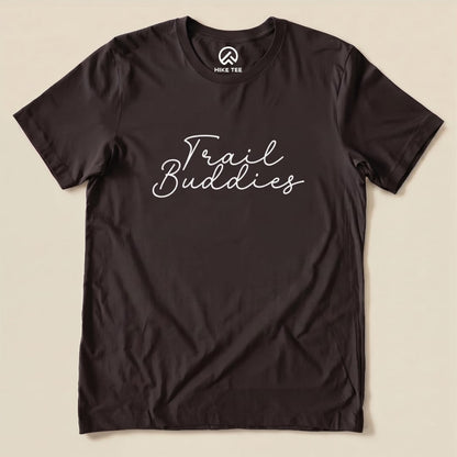 A black graphic t-shirt features the phrase "Trail Buddies" in stylish white lettering across the front.